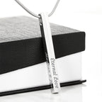 To My Wife - 4-Sided Stick Necklace, engraved pendant propped on a gift box, no card
