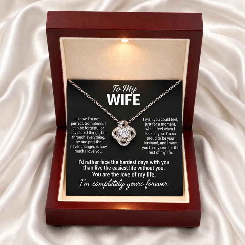 Silver Forever Yours Love Knot necklace with the selected Wife message card in an open Luxury light-up box on ivory satin